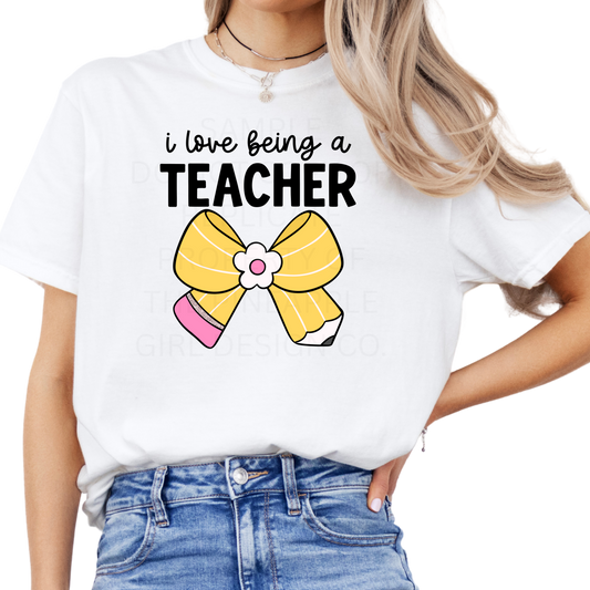 I Love Being A Teacher Bow Tee